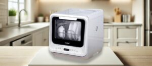 COMFEE CDC17P0AWW Dishwasher Review – Compact countertop dishwasher with dishes loaded inside, placed in a modern kitchen setting.
