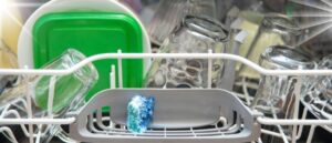 Depicting clean dishes in a dishwasher, thanks to the use of Non-Toxic Dishwasher Detergent for an Eco-Friendly Home.