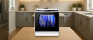 In this AIRMSEN AE-TDQR03 Dishwasher Review image, the countertop (mini / benchtop) dishwasher is showcased in a kitchen setting, emphasizing its compact design and space-saving convenience.