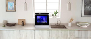 A countertop dishwasher in the kitchen depicting the topic the Countertop Dishwasher Reviews.