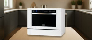 Feature image of BLACK & DECKER ‎BCD6W Dishwasher Review: The image features a countertop (mini / compact) dishwasher placed on a kitchen counter, highlighting its sleek design and modern finish that fits well in small kitchens or apartments.