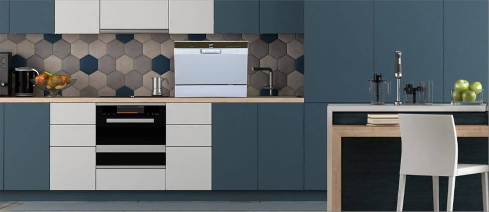 A kitchen image with SPT SD-2224DWA dishwasher on the top of the kitchen counter, which is 3'0" from the floor. A man of 5'10" height and a woman of 5'5" height are present in the kitchen.