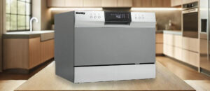 Danby DDW631SDB Dishwasher Review image showing the countertop (tabletop / benchtop) dishwasher set up on a kitchen counter, drawing attention to its minimal footprint and user-friendly front panel.