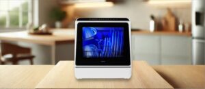 Feature image of HAVA TDQR01 Dishwasher Review: The image features a countertop (mini / compact) dishwasher placed on a kitchen counter, highlighting its sleek design and modern finish that fits well in small kitchens or apartments.