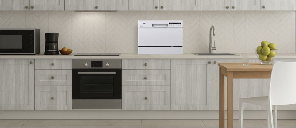A kitchen image with EdgeStar DWP62WH dishwasher on the top of the kitchen counter, which is 3'0" from the floor. A man of 5'10" height and a woman of 5'5" height are present in the kitchen.