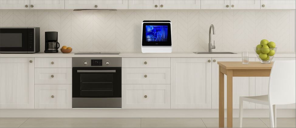 A kitchen image with HAVA TDQR01 dishwasher on the top of the kitchen counter, which is 3'0" from the floor. A man of 5'10" height and a woman of 5'5" height are present in the kitchen.