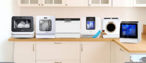 6 Best Countertop Dishwashers For Hygiene and Sterilization neatly arranged on a modern kitchen counter, showcasing different compact designs with digital controls and transparent windows displaying clean, sterilized dishes.