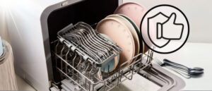 Interior view of one of the most reliable countertop dishwashers, fully loaded with a variety of clean dishes and utensils, ready for use.