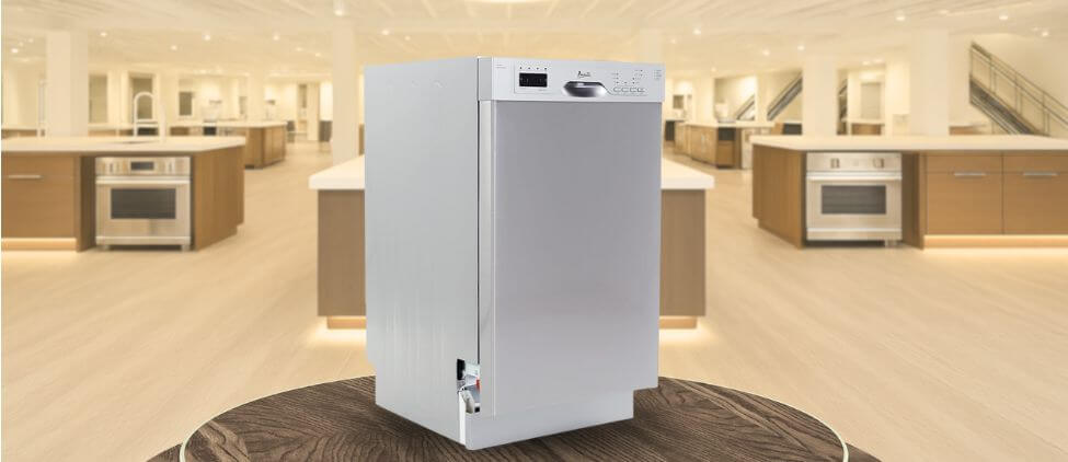 In this image, the Avanti DWF18V3S built-in (under-counter) dishwasher is displayed in a showroom setting, highlighting its modern design and sleek front panel.
