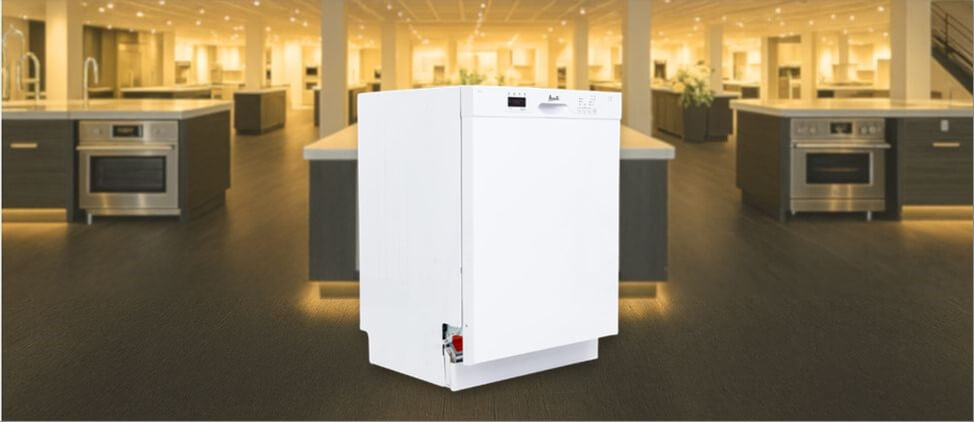 In this Avanti DWF24V0W Dishwasher Review image, the built-in (under-counter) dishwasher is displayed in a showroom setting, highlighting its modern design and sleek front panel.