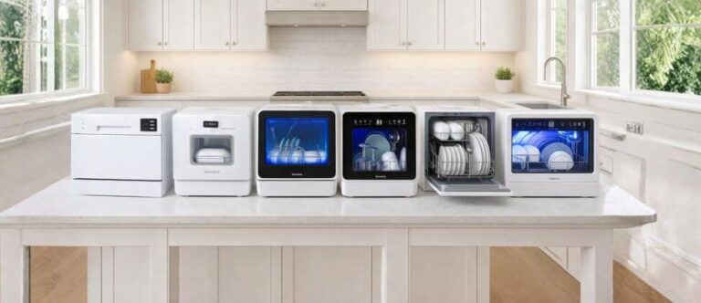 Bright and modern kitchen interior with large windows, showcasing Six Best Featured Countertop Dishwashers neatly arranged on the counter, including sleek white and glass-front designs, all organized in a clean and visually appealing display that highlights premium style and functionality.