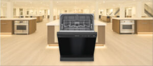 In this Frigidaire FFCD2413UB Dishwasher Review image, the built-in (under-counter) dishwasher is displayed in a showroom setting, highlighting its modern design and front panel.