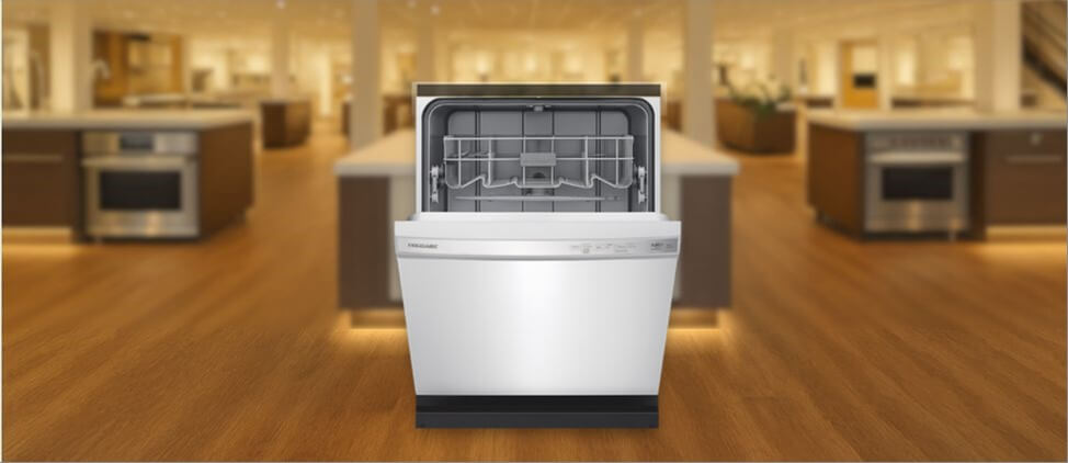 17_Frigidaire-FFCD2418US-dishwasher-review In this Frigidaire FFCD2418US Dishwasher Review image, the built-in (under-counter) dishwasher is displayed in a showroom setting, highlighting its modern design and front panel.
