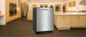In this Frigidaire GDPP4515A Dishwasher Review image, the built-in (under-counter) dishwasher is displayed in a showroom setting, highlighting its modern design and front panel.