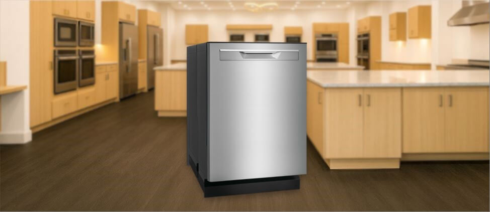 In this Frigidaire GDPP4515A Dishwasher Review image, the built-in (under-counter) dishwasher is displayed in a showroom setting, highlighting its modern design and front panel.