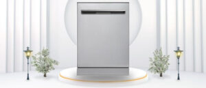 A featured image of the topic DUURA DE1200DWDSS Dishwasher Review. A DUURA ( DE1200DWDSS) dishwasher is showcased on a pedestal with a glowing halo at the base, flanked by ornamental plants and other things, set against a backdrop of elegant white curtains.