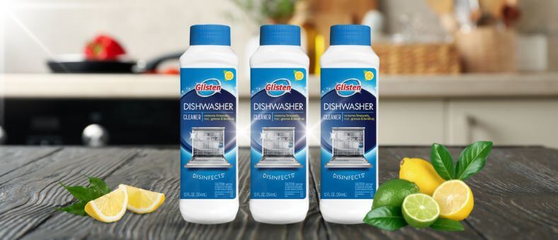 Visual demonstration of Glisten Dishwasher Cleaner bottles displayed on a kitchen countertop, representing a powerful solution for disinfecting and maintaining a clean, fresh dishwasher, complemented by citrus elements in the background.
