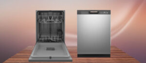 GE GDF535PSRSS dishwasher showing front view with stainless steel finish and open interior racks on wooden surface.