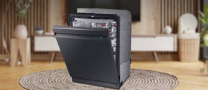 Feature image of SAMSUNG DW80R9950UG Dishwasher Review: The image shows the built-in (under-counter) dishwasher is placed in an appliance showroom, displaying the dishwasher’s refined and modern look, with a streamlined front panel and stylish build that complements today’s kitchens.