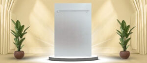 A featured image of the topic ZLINE ‎DW-304-H-18 Dishwasher Review. A ZLINE ‎DW-304-H-18 dishwasher is showcased on a pedestal with a glowing halo at the base, flanked by ornamental plants and other things, set against a backdrop of elegant white curtains.