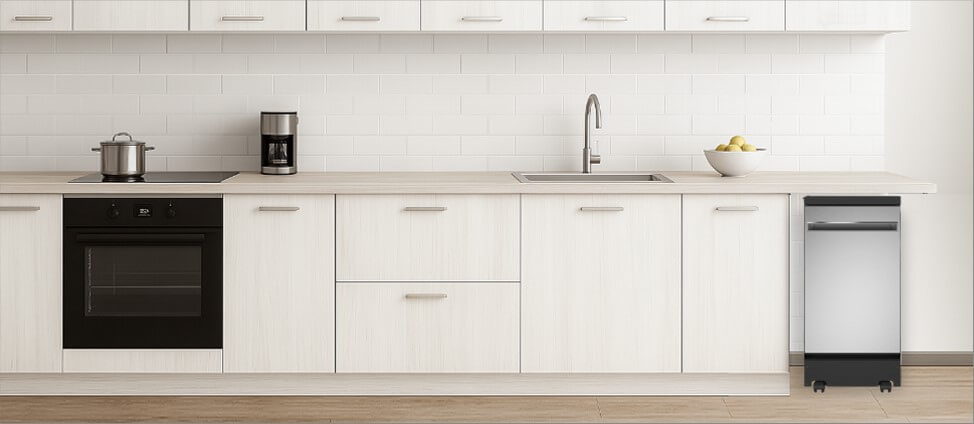 A bright, contemporary kitchen with built-in cabinetry and modern appliances. In the corner, the freestanding GE GPT145SSLSS dishwasher stands independently on its wheels, offering both mobility and functionality without disrupting the clean, open kitchen layout.