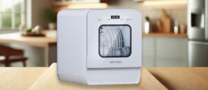 AIRMSEN C01 Dishwasher Review – A sleek AIRMSEN C01 countertop dishwasher with a transparent viewing window, placed on a wooden counter in a modern kitchen setting. The digital display is visible.