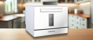 Farberware FCD06SDWHT Dishwasher Review (Large Image): A high-resolution image of the Farberware FCD06SDWHT countertop dishwasher, featuring a sleek white body, a modern digital display, and a pull-down door, placed in a bright, stylish kitchen.