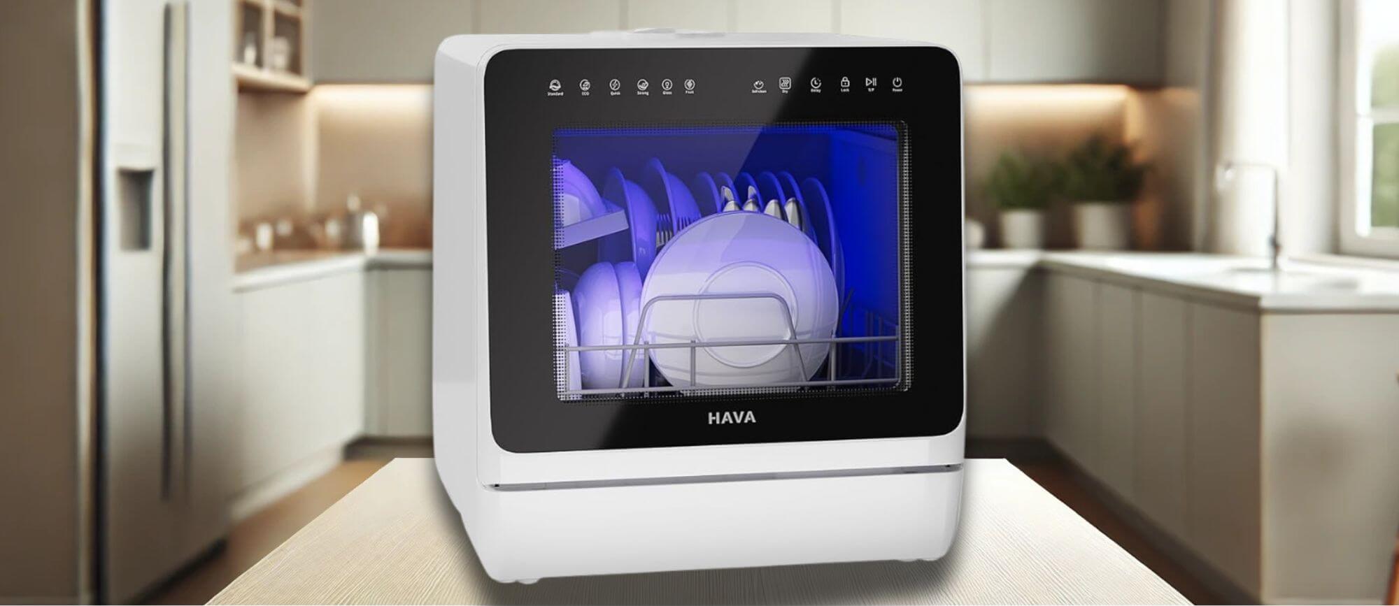 A stylish, compact HAVA TDJR09 countertop dishwasher displayed in a modern kitchen setting. The dishwasher is actively running with dishes inside, illuminated by a blue light. Its sleek white design blends seamlessly with contemporary home decor. Its a featured image of the topic "HAVE TDJR09 Dishwasher Review"