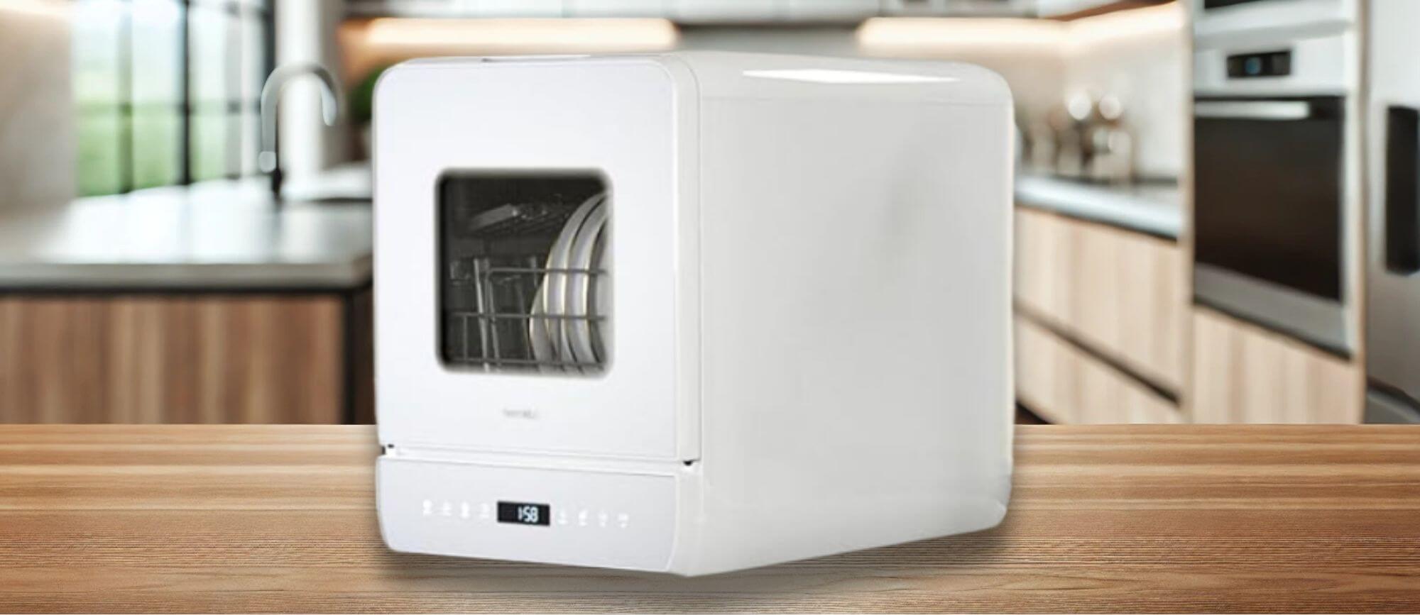 Hermitlux HDW5CW02 Dishwasher Review - Side View: A high-quality image of the Hermitlux HDW5CW02 dishwasher on a kitchen counter, featuring its solid white body, touch control panel, and digital display. Its featured image of the topic "Hermitlux ‎HDW5CW02 dishwasher review"