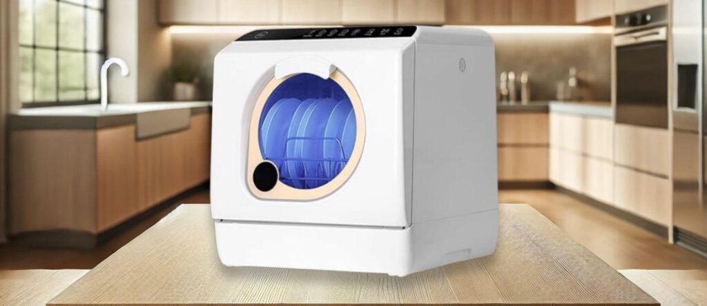 LINGXI LX XWJ01 - Best Quietest Budget Countertop Dishwasher: The LINGXI LX XWJ01 compact countertop dishwasher with a round transparent viewing window, digital controls, and a sleek white body with a black control panel, placed on a kitchen counter.