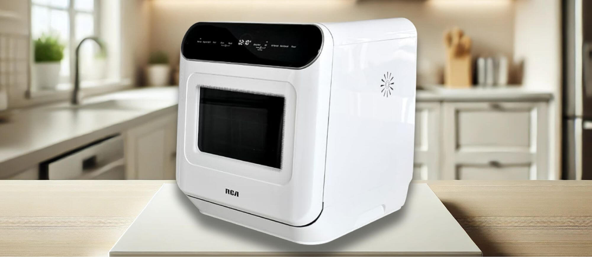 RCA RDW3216 Dishwasher Review – The RCA RDW3216 compact countertop dishwasher placed on a kitchen counter, showcasing its modern design, transparent viewing window, and digital touch panel.