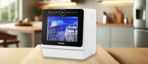 SEAGTOM TDQRO9 Dishwasher Review – A realistic image of the SEAGTOM TDQRO9 countertop dishwasher placed in a modern kitchen setting, showcasing its compact design, transparent viewing window, and digital control panel.