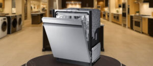 Feature image of SAMSUNG DW80CG5450SR Dishwasher Review: The image shows the dishwasher is placed in an appliance showroom displaying the dishwasher’s refined and modern look, with a streamlined front panel and stylish build that complements today’s kitchens.