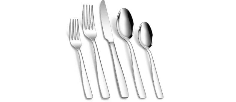 KINGSTONE 40-piece flatware set displayed with dinner forks, salad forks, knives, soup spoons, and teaspoons, showcasing a shiny, minimalist stainless steel finish.
