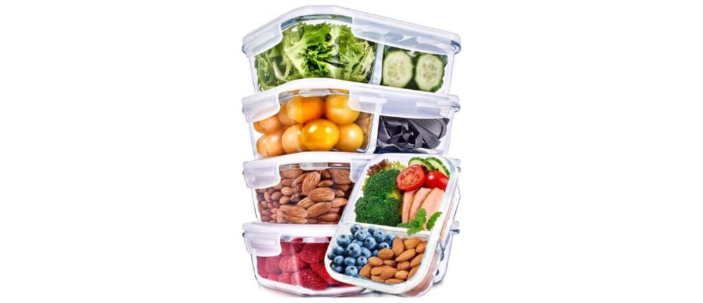 A tall stack of PrepNaturals glass meal prep containers with separate compartments for vegetables, nuts, and fruits.