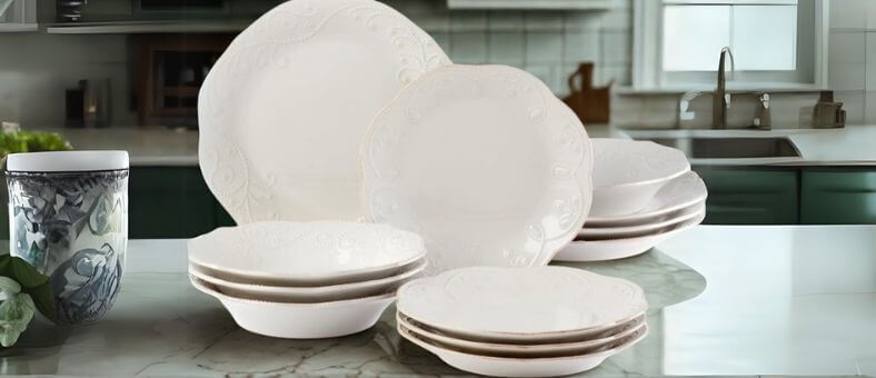 Lenox French Perle 12-piece dishwasher-safe dinnerware set with embossed detailing, displayed elegantly in a vintage-inspired kitchen setting.