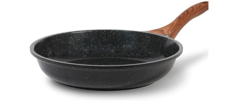 A speckled black nonstick frying pan featuring a wood-textured handle, placed against a white background.