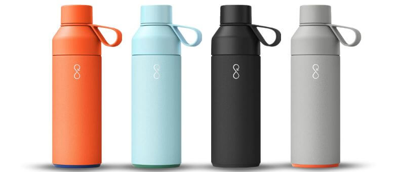 Ocean Bottle Reusable Water Bottles in vibrant colors with looped caps, made from recycled stainless steel and designed for eco-conscious hydration.