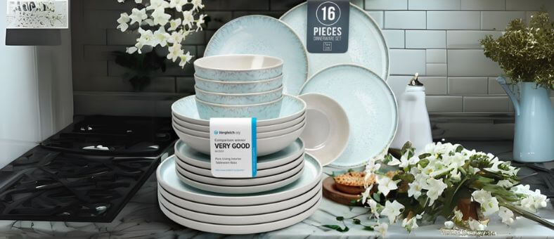 PURE LIVING 16-piece stoneware dinnerware set with a soft blue speckled design, placed in a stylish kitchen, emphasizing its dishwasher-safe build.