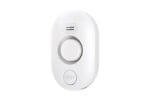 03- METAK Water Leak Detector Small Oval-shaped water leak detector with a test button resting on a wooden floor near a water spill.