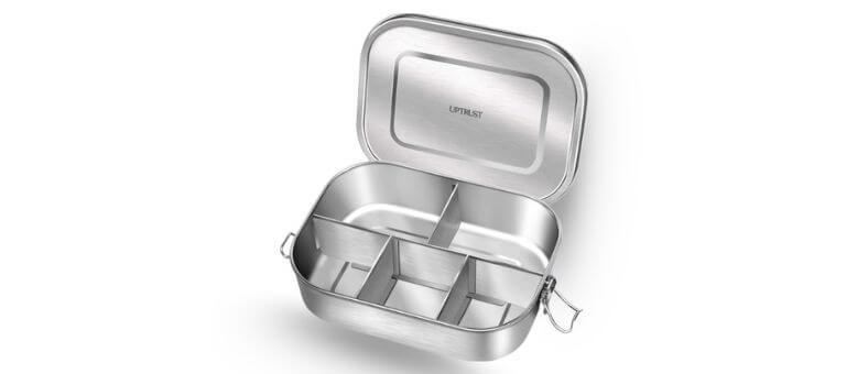 A large stainless steel bento lunch box with five compartments and secure metal locking clips.