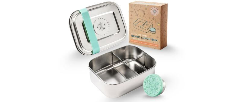 A four-compartment stainless steel lunchbox with mint green accessories, including a band and sauce container.