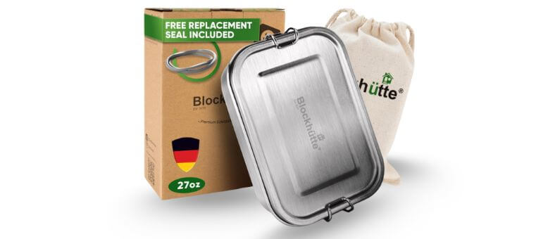 A closed stainless steel lunchbox next to its eco-friendly packaging and drawstring storage pouch.