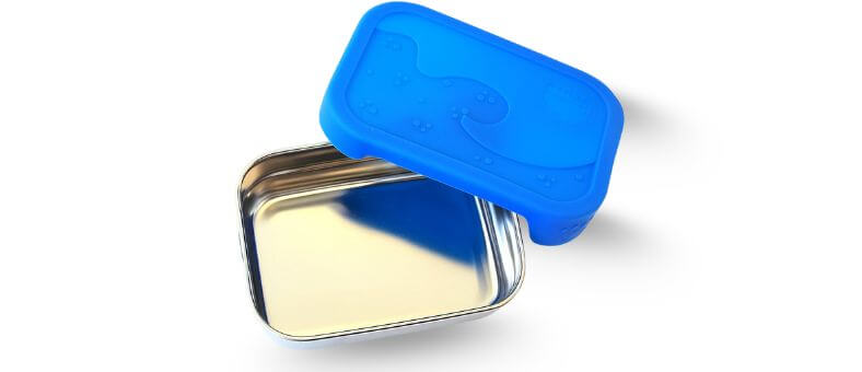 A simple stainless steel lunchbox with a bright blue silicone lid featuring embossed paw prints.