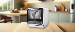 Midea MDC17P0ABB Dishwasher Review image showing the countertop (tabletop / benchtop) dishwasher set up on a kitchen counter, drawing attention to its minimal footprint and user-friendly front panel.