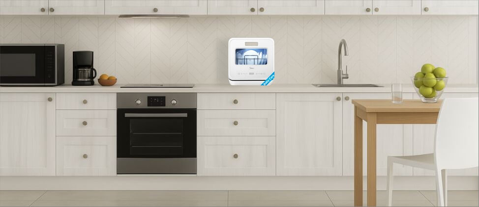 A visual size comparison chart displaying theMidea MDC17P4CWW dishwasher alongside a standard kitchen counter and average human heights. The graphic helps users understand its compact dimensions and how it fits within a regular kitchen environment.