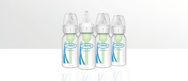 • Dr. Brown's Natural Flow Anti-Colic Bottles – Four clear baby bottles with green vent system and white caps, arranged on a white background.