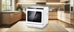 Feature image of AooDen AO-PDW-W-1 Dishwasher Review: The image features a countertop (mini / compact) dishwasher placed on a kitchen counter, highlighting its sleek design and modern finish that fits well in small kitchens or apartments.