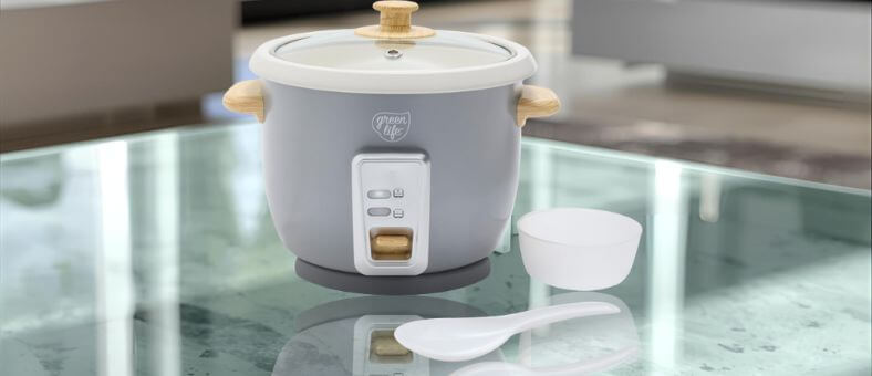 GreenLife dishwasher safe rice cooker with wooden accents, included spoon and measuring cup.