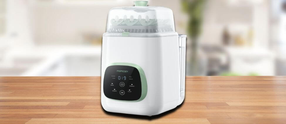Momcozy KleanPal Pro Washer Review image showing the set up on a kitchen counter, drawing attention to its minimal footprint and user-friendly front panel.